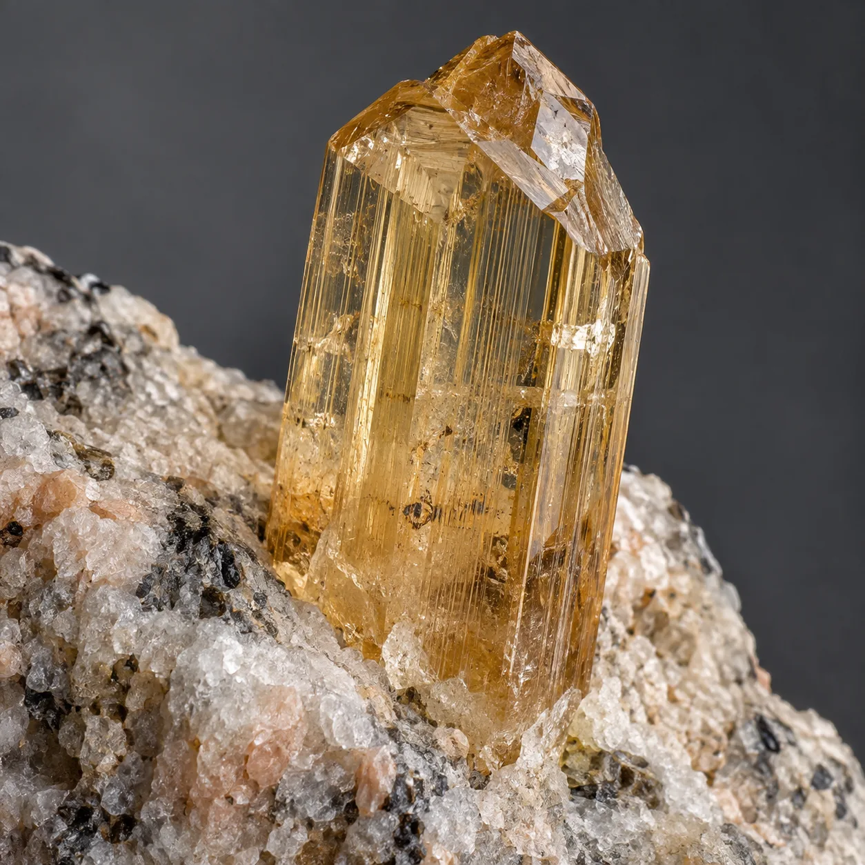 Generated macro view of a golden prismatic topaz crystal in granitic matrix